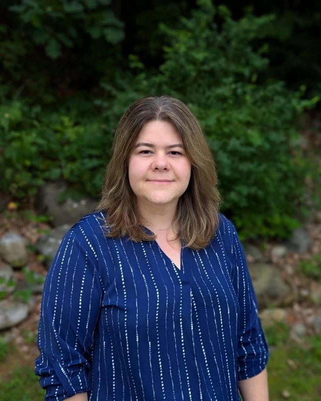 Marta Sarzynski, APRN, FNP-BC, smiling outdoors